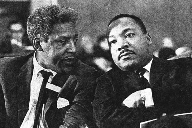 Bayard Rustin and Dr. Martin Luther King Jr. in conversation.