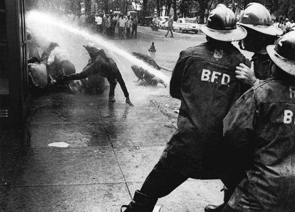 Firefighters turn their hoses full force on civil rights demonstrators in Birmingham, Alabama, on July 15, 1963.