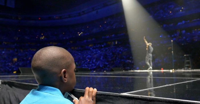 Kevin Hart's son/ Hart on stage at TD Garden